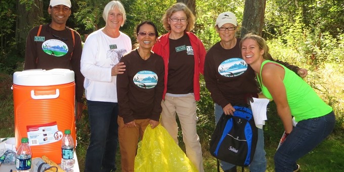Six Sammamish stewards pause their work for a moment to smile for the camera.