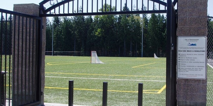 soccer field through a gate in eastlake community fields