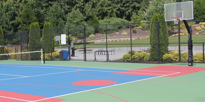ebright creek park blended tennis / basketball court with picnic area behind