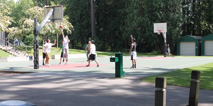 people playing basketball at pine lake park