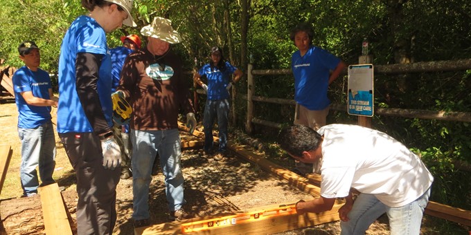 Seven Sammamish stewards collaborating on a trail project.